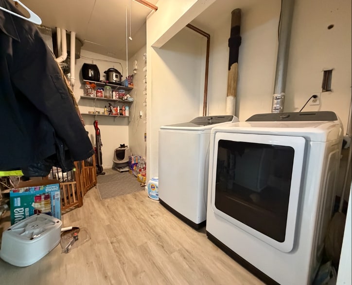 In home laundry. Attic entrance here with incredible storage. - 1101 S Cottage Grove Ave