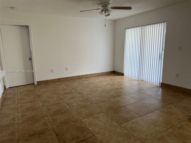 Building Photo - 9491 Palm Cir S