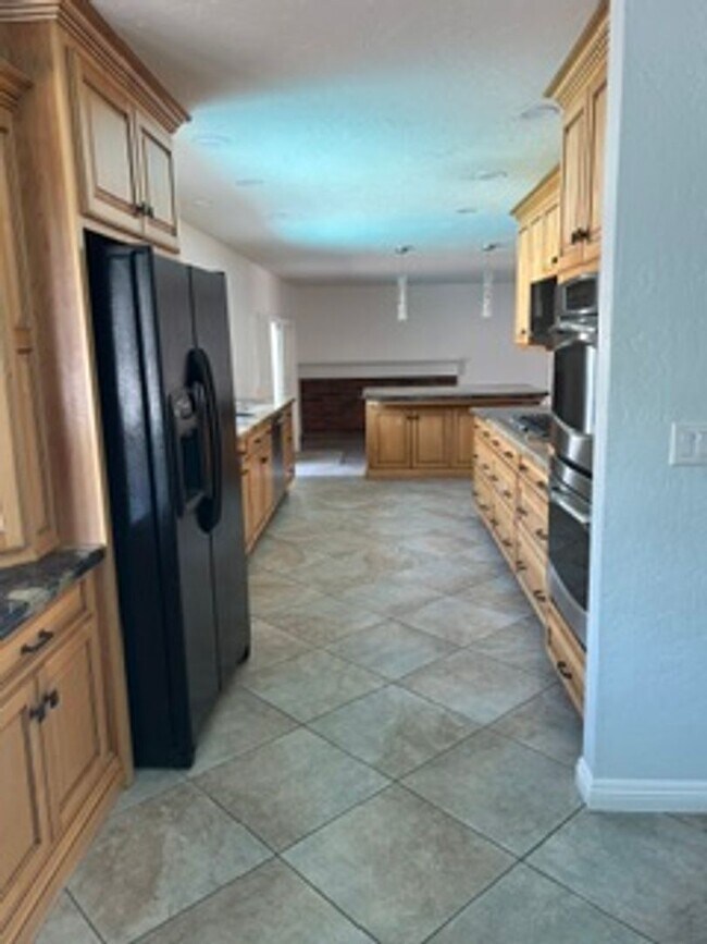 Building Photo - Spacious 4BR Home with Gated Pool, Chef’s Kitchen & 3-Car Garage