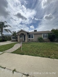 Building Photo - Dinuba Home! Available Now !