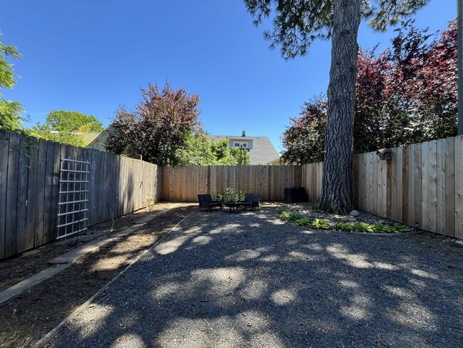 Building Photo - Charming Cottage with Hardwood Flooring, Modern Kitchen & Beautiful Outdoor Living Areas