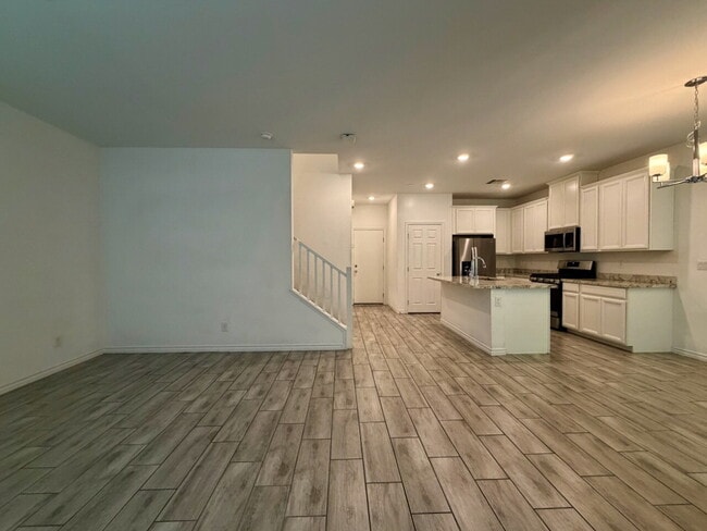 Building Photo - GATED 3 BED 2.5 BATH TOWNHOME WITH 2-CAR GARAGE, COVERED PATIO & COMMUNITY POOL