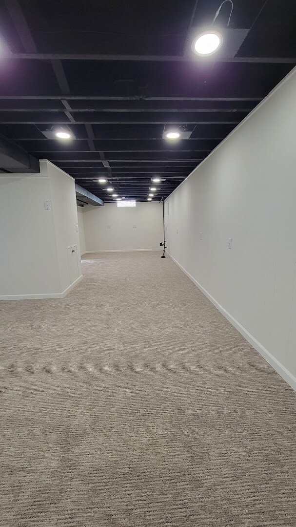 Partially finished basement with new carpeting, paint, trim, lighting and remodeled bathroom.. - 6305 49th Ave