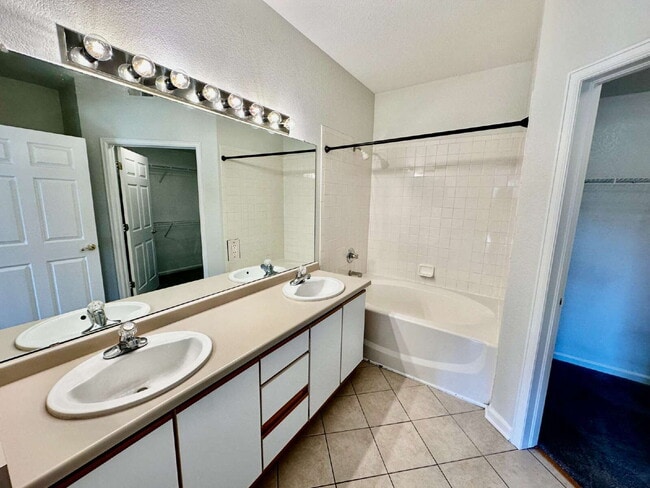 Building Photo - "Spacious 2-Bed, 2-Bath Condo with Pool Ac...