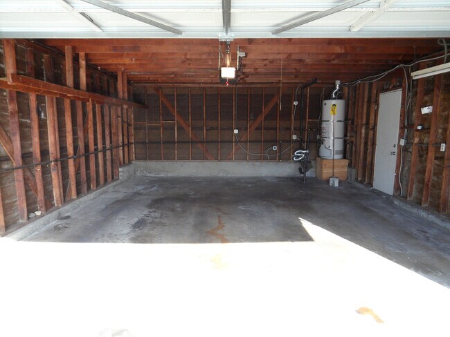 Building Photo - Two Story 4 BR 2.5 BA Condo With 2 Car Garage