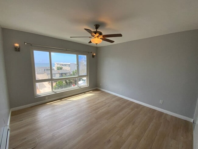 Building Photo - Long-Term Unfurnished Rental – Available N...