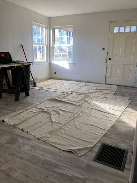 Reno update: Living Room; highlighting floors and layout. What's next? Paint touch ups, new trim, new baseboards, new counter tops, and new doors. - 1395 Ross Ave
