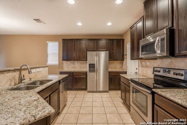 Building Photo - Comfortable Living in a Gated Community Near It All