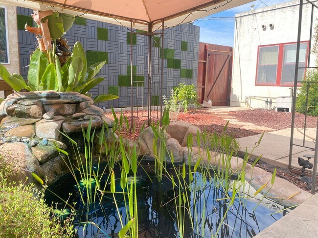 Building Photo - CHARMING! BACKYARD OASIS! REAL HARDWOOD FLOORS! FULL SIZED WASHER/DRYER! OFF OF ADAMS AVE!