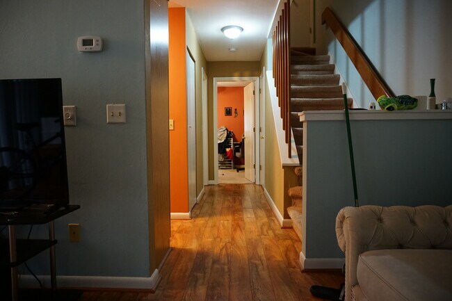 Hallway leading to kitchen, stairs, and first floor bedroom/bathroom - 505 Sunridge Dr