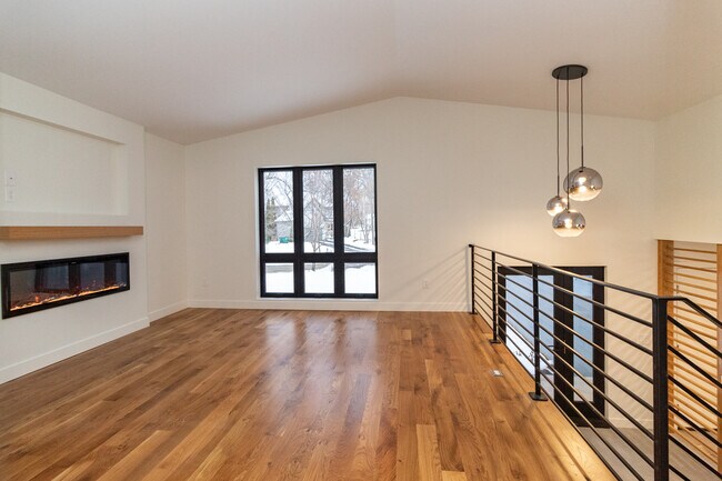 Living room w/ fireplace & TV recess - 5590 Harding Ln