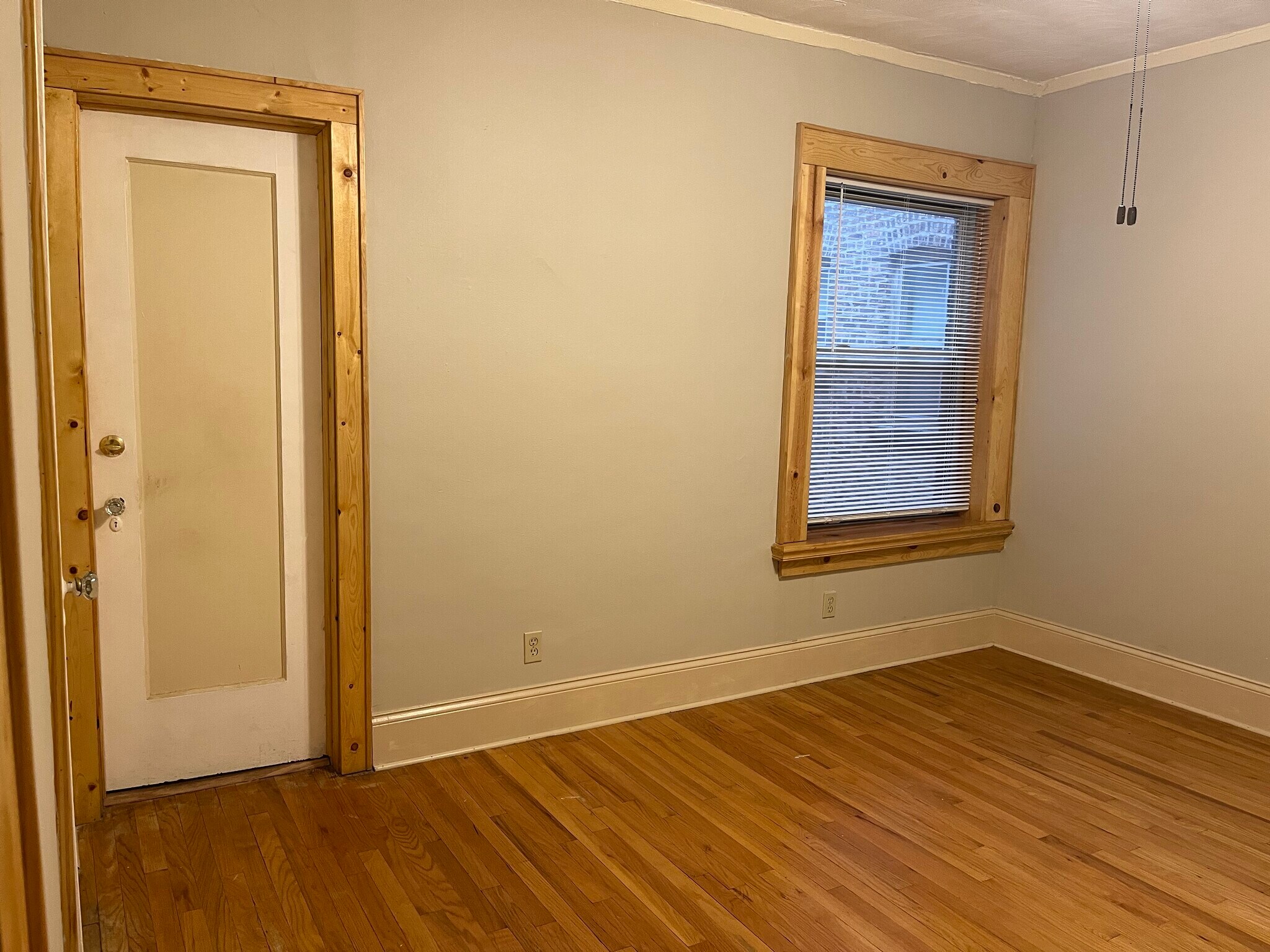 Access to bathroom from front bedroom with a very large window - 7619 S Phillips Ave