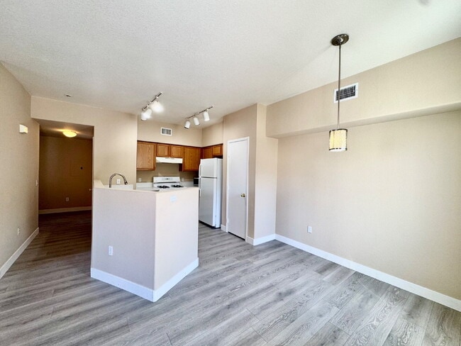 Building Photo - DOWNSTAIRS CONDO | GATED COMMUNITY | CENTENNIAL HILLS | UPDATED 3 BEDROOM