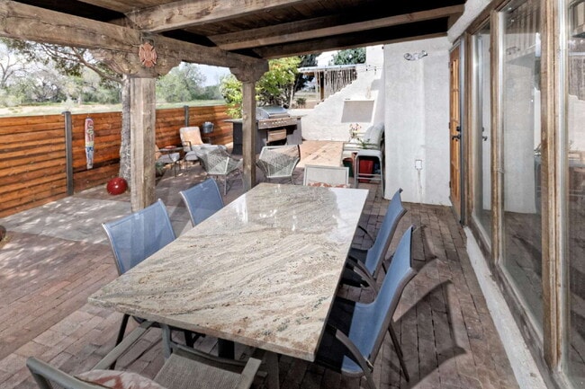 Building Photo - One-of-a-kind adobe brick home backing up ...