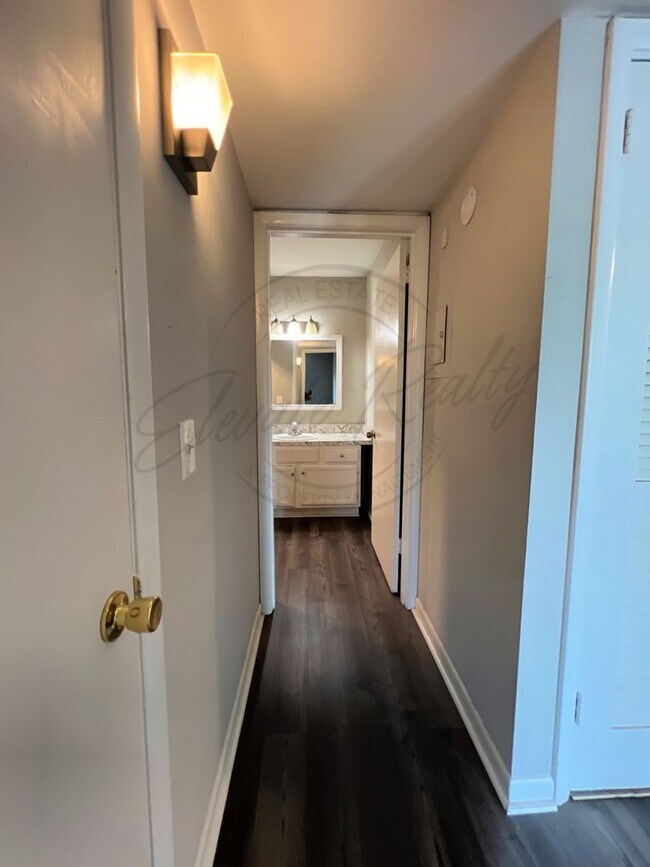 Building Photo - One Bedroom Condo, FIRST FLOOR, Assigned P...