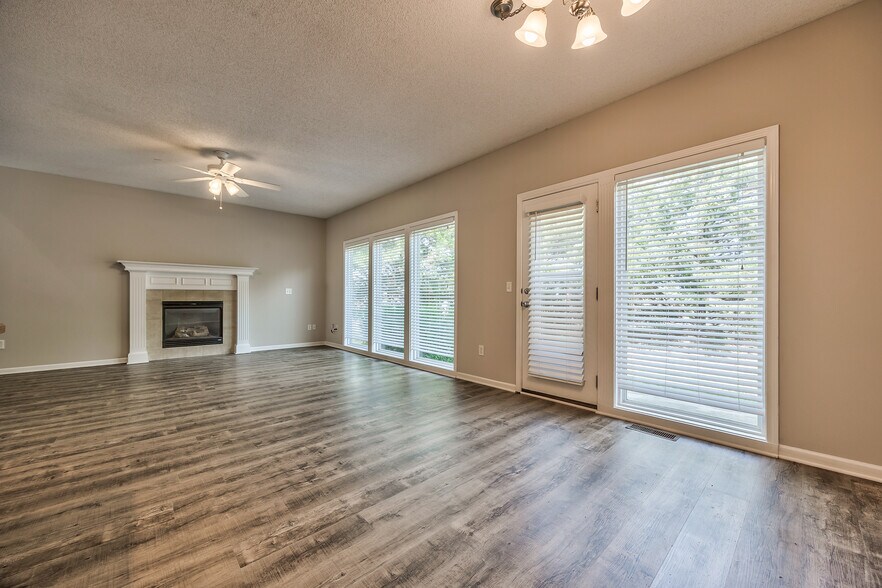 Living room with door to patio - 22810 West 71st Terrace