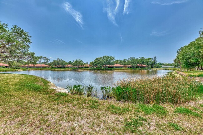 Building Photo - BEAUTIFUL 2 BEDROOM 2 BATHROOM + A DEN VILLA WITH GORGEOUS LAKE VIEWS!