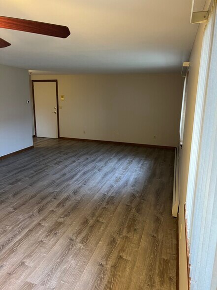 Living room, door leading out. - 3890 Ridge Lea Rd
