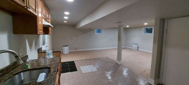 Building Photo - "Expansive 5-Bedroom Haven with Dual Kitch...