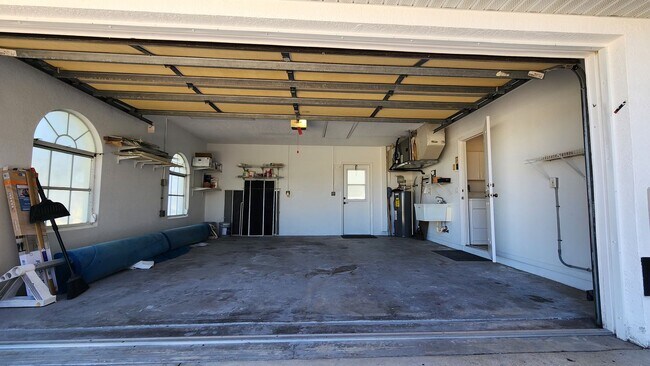 Building Photo - Fresh Paint, New Floors, and a Heated Pool...