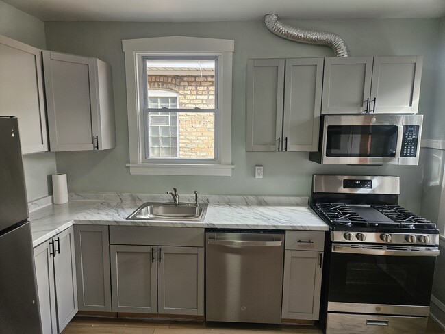 Building Photo - 6125 W Newport Ave