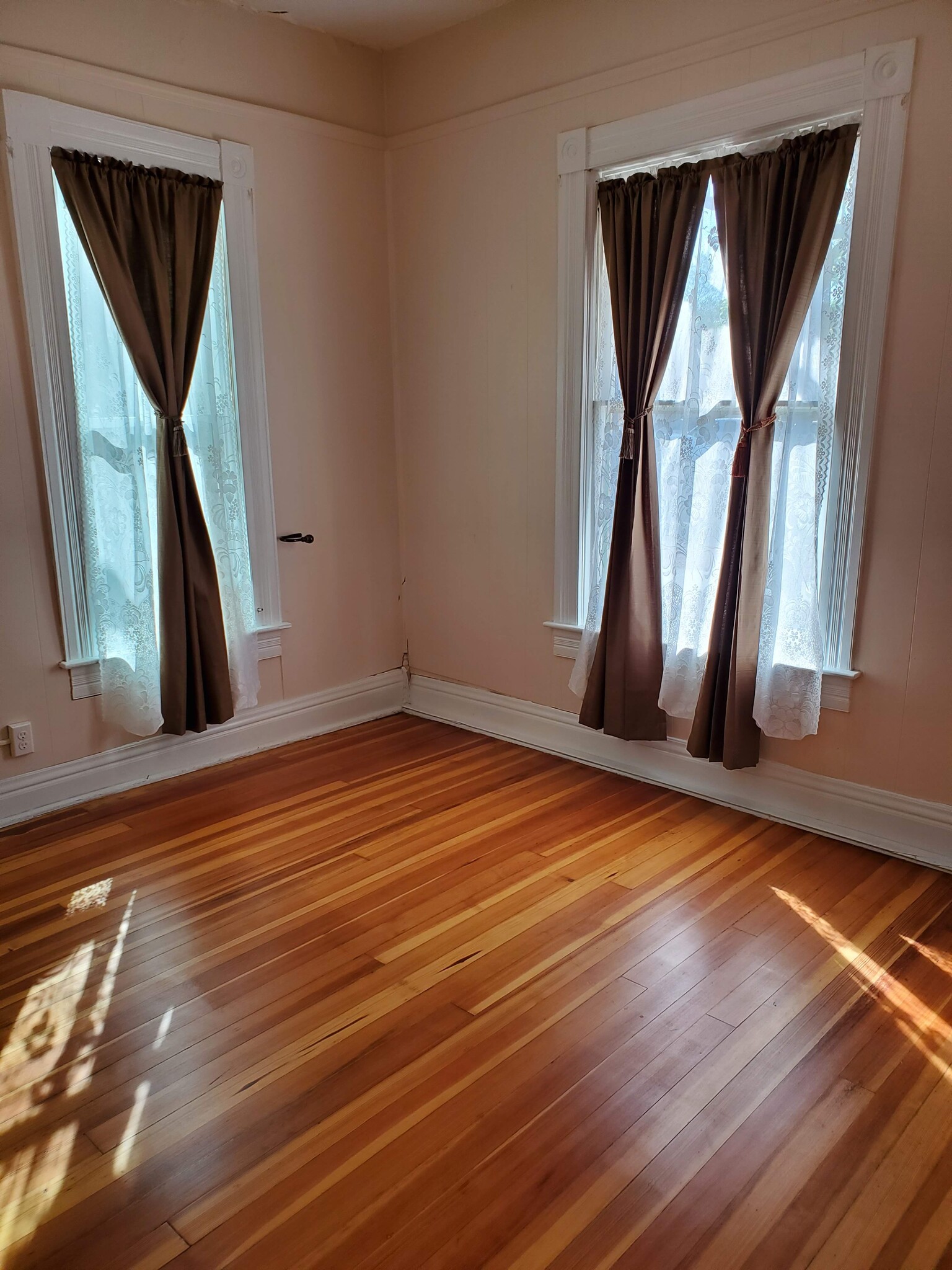 Front bedroom is light-filled by two large windows - 607 Harrison Ave