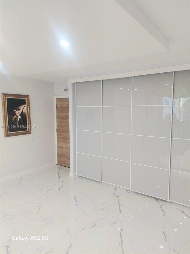 Building Photo - 5005 Collins Ave