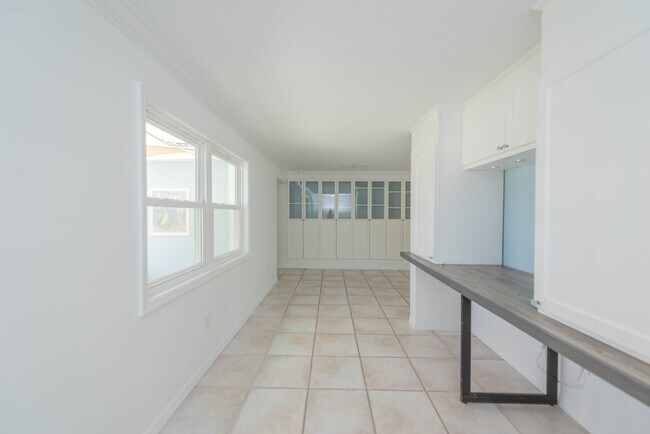 Building Photo - Live the ultimate Space Coast waterfront lifestyle at this stunning beachside canal home in Satel...
