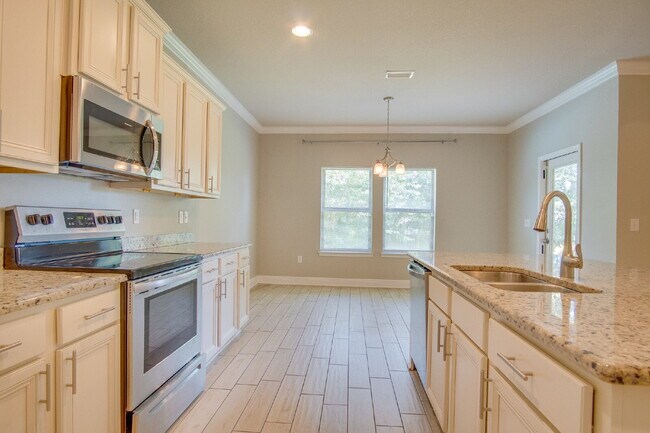 Building Photo - Spacious 4BR Pool Home with Modern Upgrade...