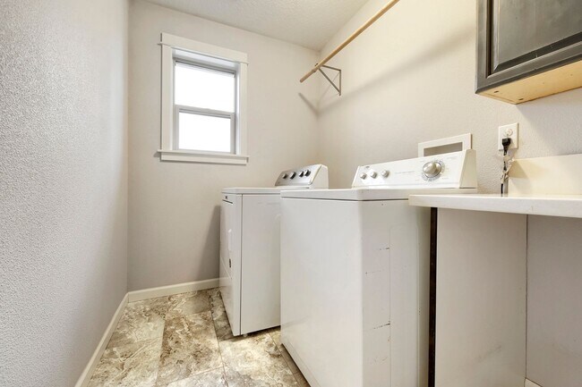 Building Photo - Custom-Built 4BR/2.5BA Two-Story Near Woodstock — Quartz Island Kitchen, Gas Fireplace & Fenced Y...
