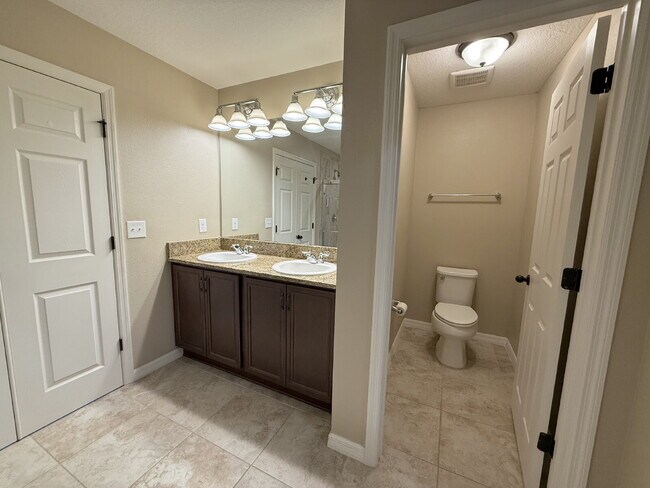 Building Photo - Spacious 4-Bedroom Retreat with additional office/den in the Heart of Trinity!