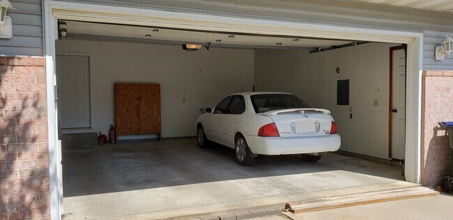 #330 - Garage, right side of garage,entrance to unit to right of car - 330 Cayman St