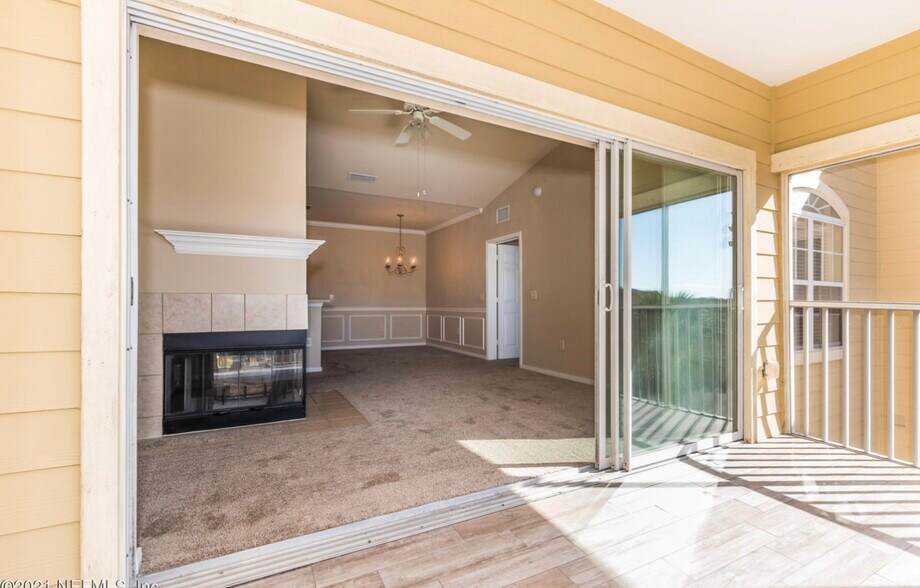 Open living room w fireplace - 275 Old Village Center Cir