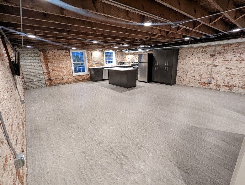 A view of the open concept kitchen/dining/living area. Photo may not be exact. - 130 E State St