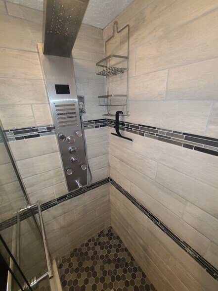 Tower shower panel with horizontal jets, Hand held sprayer with two options, and tub spout - 122 Edgerton Rd