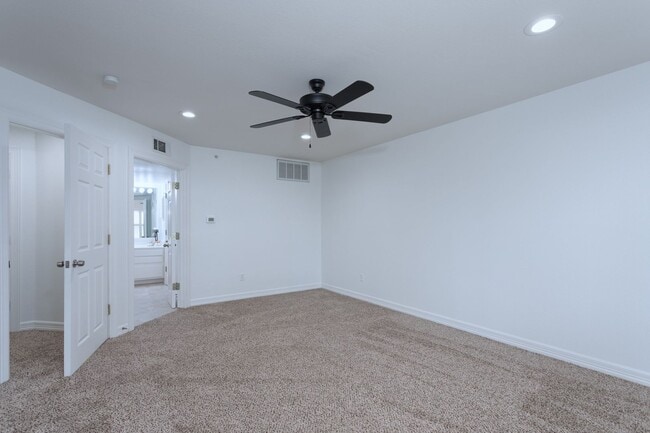 Building Photo - Gorgeous Mediterranean-style condo located...