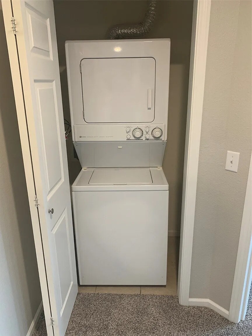 Included stacked washer and dryer in unit. - 105 NW 8th St