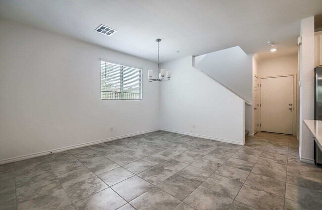 Building Photo - Modern Gated Townhome with Spacious Open Layout & Designer Kitchen!