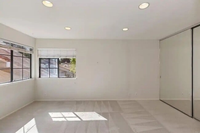 Building Photo - Upgraded La Costa Townhome