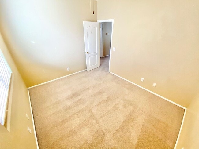 Building Photo - THIS SPACIOUS RESIDENCE FEATURES 4 BEDROOM...