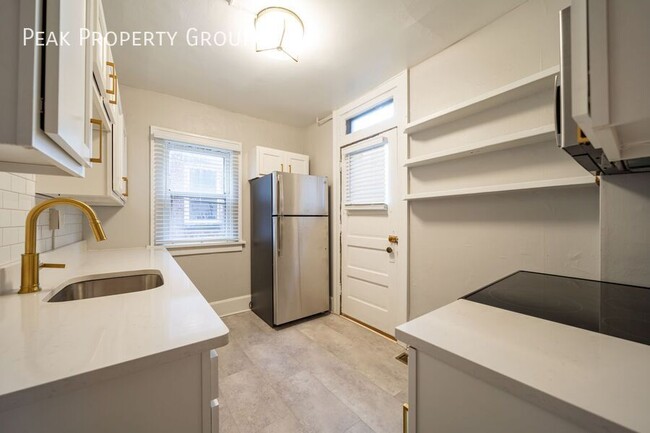 Building Photo - MOVE IN NOW! Newly Renovated Townhome! Loc...