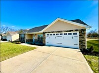 Building Photo - Vibrant 4 Bedroom Getaway with Hot Tub
