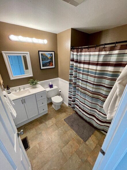 Upstairs bathroom with shower and tub. - 1131 115th St SW