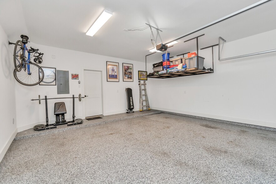 Two-Car Garage with ceiling storage and floors treated with Polyaspartic coating - 1815 Elite Dr