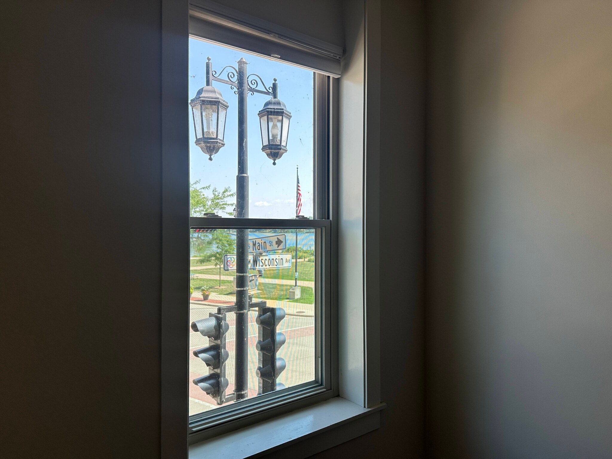 View of Village Green and Fowler Lake from Living Room - 107 W Wisconsin Ave
