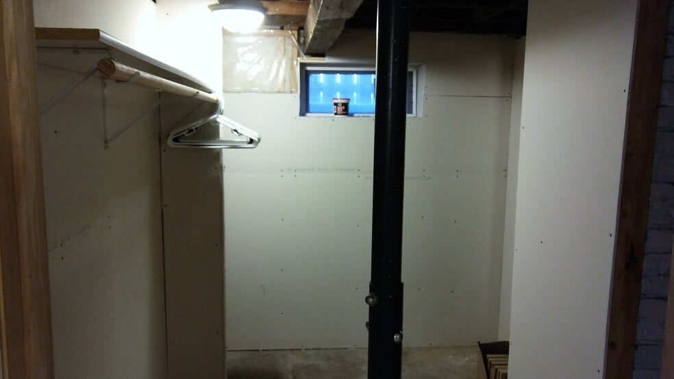 storage room, more storage under stairs and another room to the right. - 114 Walnut Street