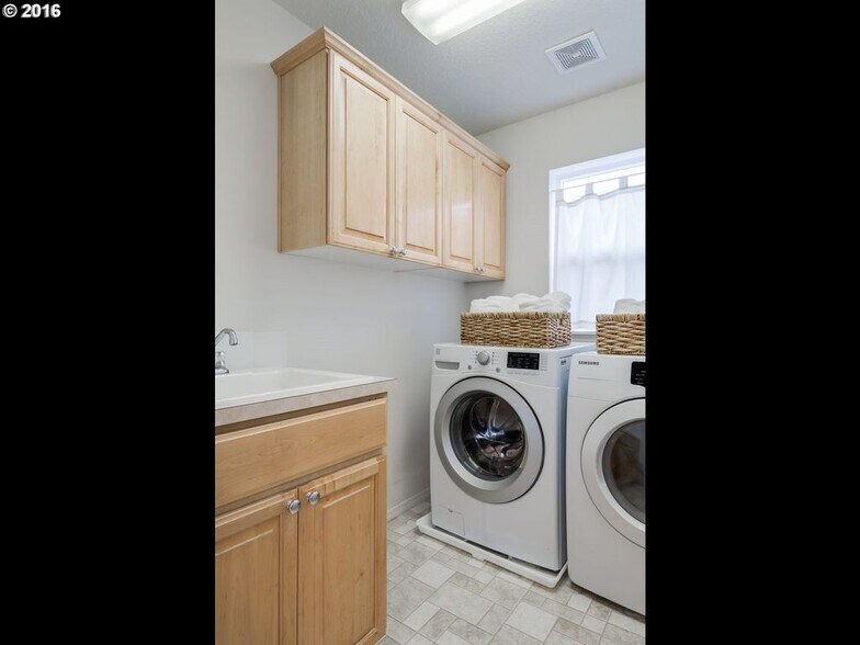 Laundry room with washer and drier provided - 6241 SW 205th Avenue