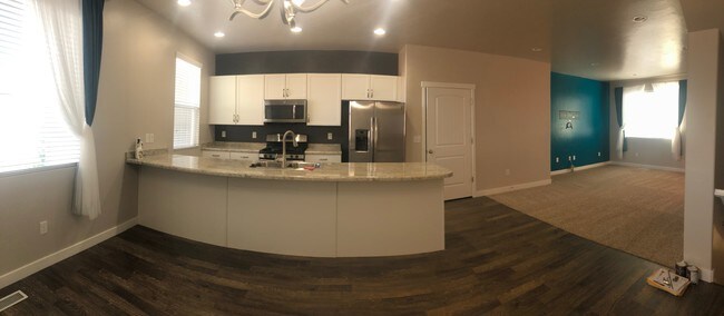 Panoramic view of kitchen and living room - 3657 W Sunrise Sky Ln