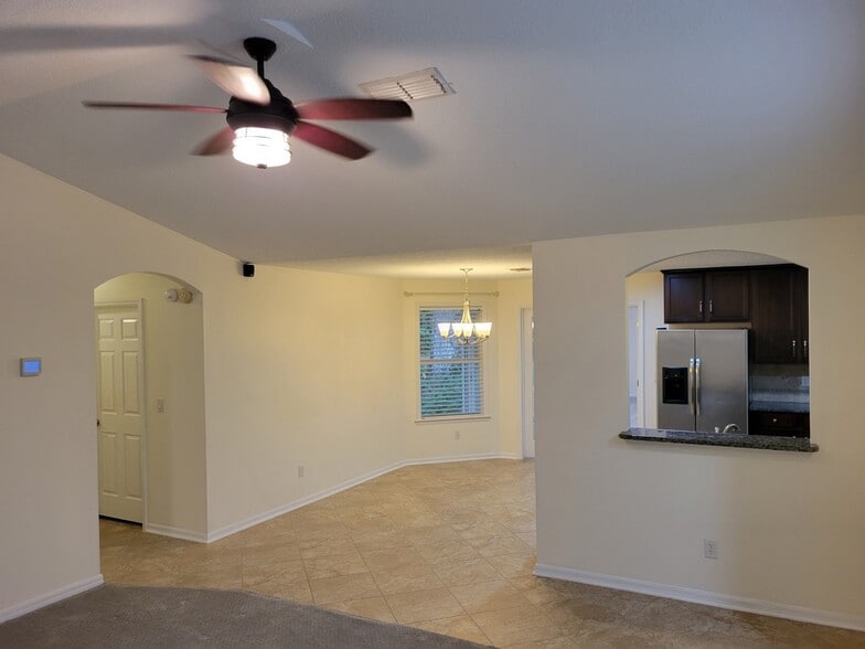 Breakfast area, guest bath in hall to left - 4538 Palmetto Cove Ln