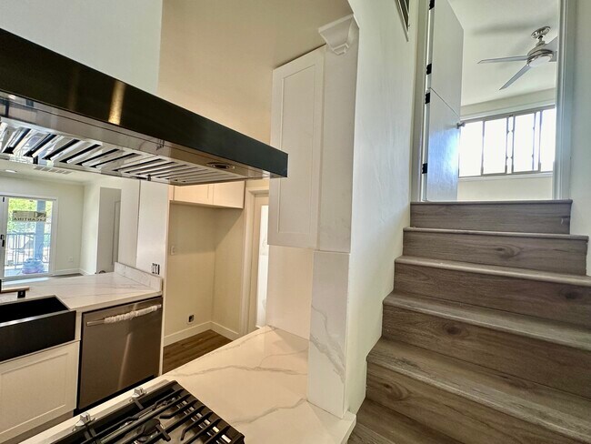 Staircase next to family room up to bedroom #4 - 1241 Elmer St